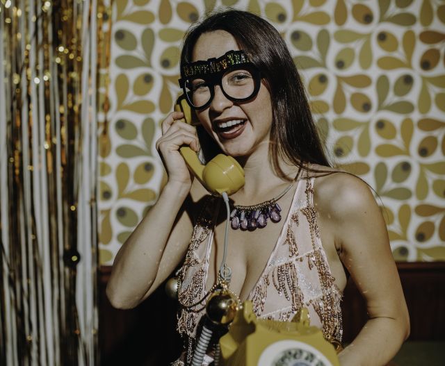 Beautiful Woman Holding a Telephone